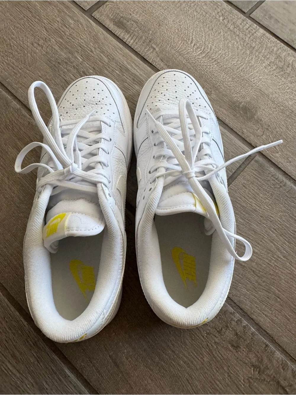 Nike White Low-Top Sneakers with Yellow Logo Accents